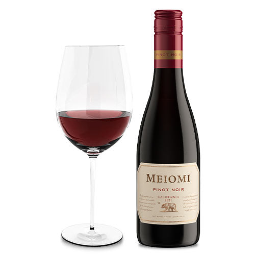 A glass of wine is next to a bottle of 2022 Meiomi Pinot Noir 375ml on a white background